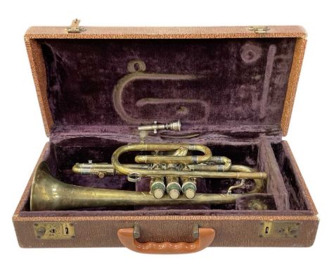An early to mid 20th century brass trumpet, with mouthpiece and indistinct inscription to the end of the horn, length excludi
