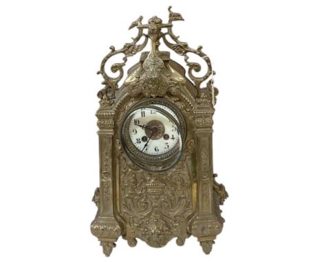 An early 20th century brass cased mantel clock, with pendulum and striking movement, height 42cm.
