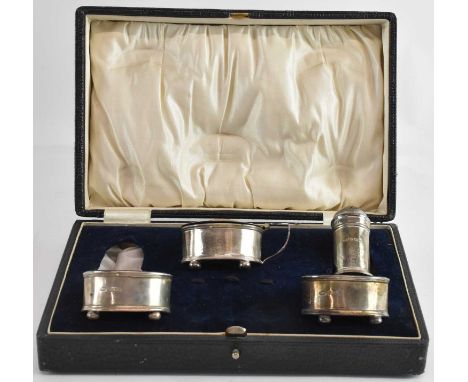 ERNEST DRUIFF &amp; CO; a cased George V hallmarked silver four piece cruet, comprising two open salts, mustard and one peppe