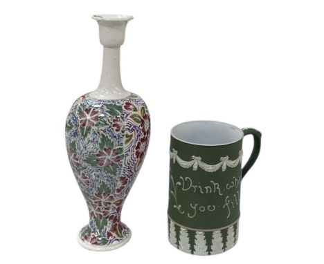 HARRY BARNARD FOR ROYAL DOULTON; a green jasperware mug 'fill what you will drink what you fill', height 14cm and diameter 9.