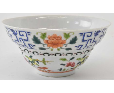 A Chinese hand painted floral decorated wide rim bowl, painted in enamels and decorated with foliage and branches, with blue 