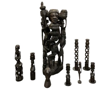 A large African carved ebony Ujamaa family tree of life sculpture, height 61.5cm, a smaller example, height 30cm, a pair of A