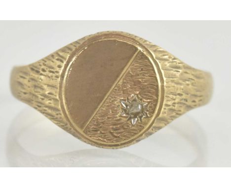 A 9ct gold signet ring, with diagonal floral pattern inset with tiny diamond, size Y, approx 3.8g.