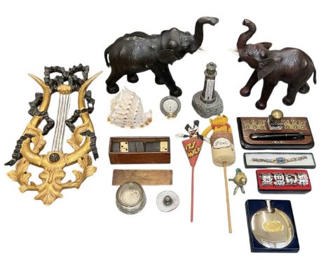 A pair of modern Japanese leather clad models of elephants, both with plastic tusks, height 32cm, a cased set of dominoes, ha