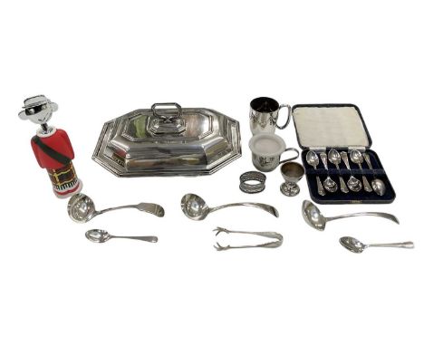 A small quantity of silver plated items, including an octagonal lidded tureen, christening mug, three ladles, a pair of sugar