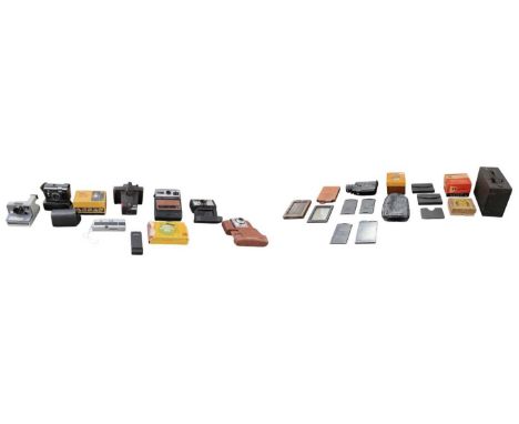 A quantity of camera and photography equipment including Kodak EK100, Polaroid Button, Kodak 155X Instamatic, Kodak Bantam Co