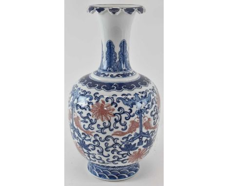 A modern Chinese blue and white baluster form vase, decorated with koi carp amongst scrolling foliage, with blue Qianlong mar