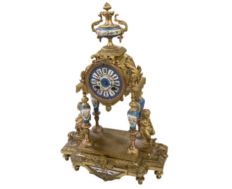 A late 19th century French gilt metal and ormolu mounted mantel clock, with hand painted porcelain set plaques, the hand pain