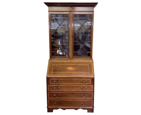 An early 20th century Edwardian mahogany and satinwood crossbanded shell inlaid bureau bookcase, with a pair of glazed doors 