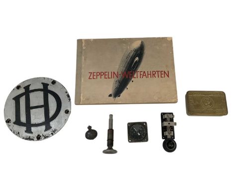 A 1930s German book of the Zeppelin-Weltfahrten, De Havilland wheel plaque, diameter 21.5cm, a WWII military aeroplane altina