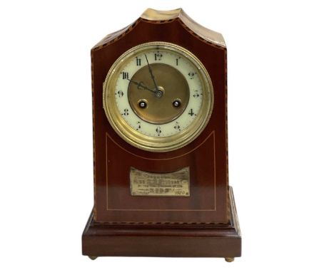 An Edwardian mahogany and inlaid mantel clock, with plaque to front inscribed 'Presented to Miss A. M. Stoddart by the York B
