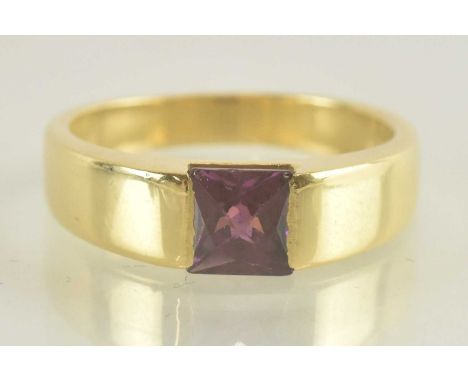 An 18ct yellow gold purple tourmaline set signet ring, with certificate of guarantee from Yannis Nikolidakis Gold Brokers, Gr