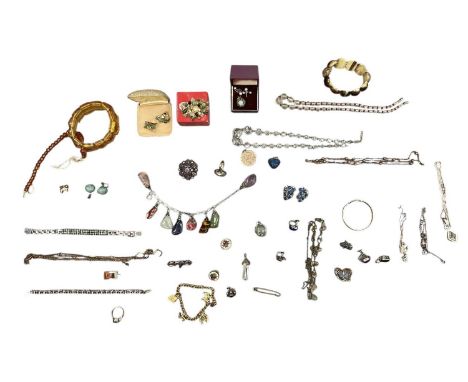 A collection of various items of mixed costume jewellery, including a gold coloured metal expandable child's bracelet, an amb