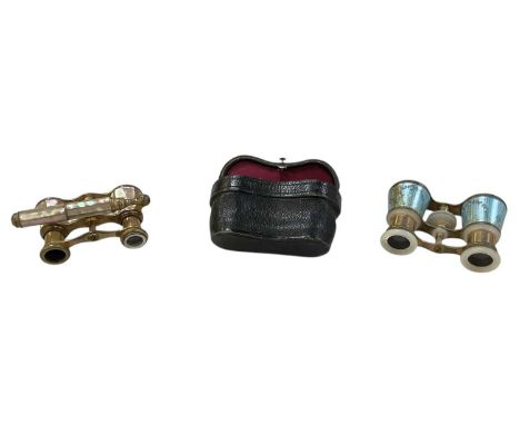 A cased pair of early 20th century mother of pearl mounted florally guilloche enamelled opera glasses and a further pair of A