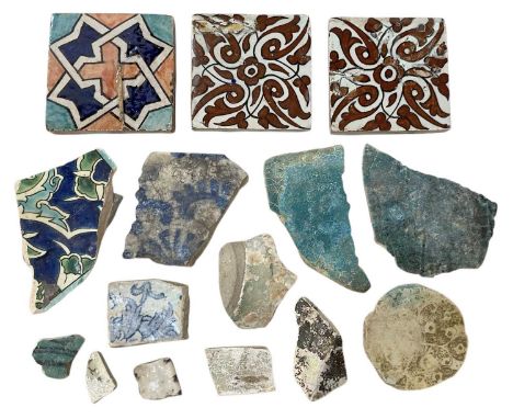 A collection of ancient Eastern tile fragments.