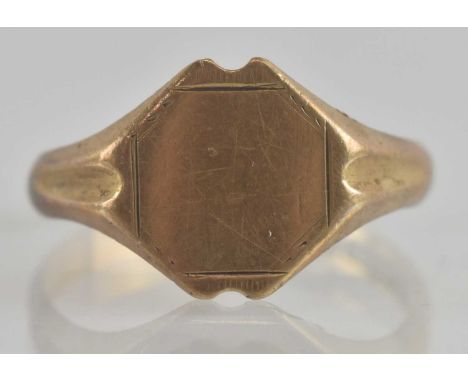 A 9ct gold signet ring with blank table, size V, approx 2.7g.