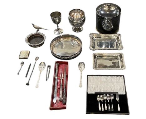 A small quantity of silver plated items, including a rectangular tureen, wine coaster, goblet, peacock, flatware, carving set