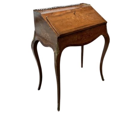 A late 19th century French kingwood and marquetry inlaid gilt metal mounted bureau, the fall front enclosing fitted interior 