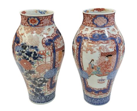 A large pair of late 19th century Japanese Imari decorated baluster form vases, both height 42cm (one af).Condition Report: P
