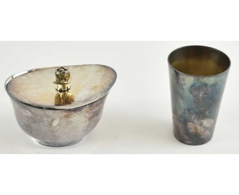 A sterling silver oval lidded condiment pot, the handle modelled as a flower, 10 x 7.5cm, and a white metal beaker, engraved 
