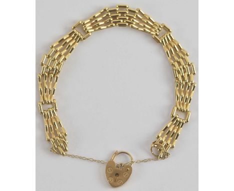 A 9ct gold four bar gate bracelet with 9ct gold heart shaped padlock clasp, length 16cm, approx 9.47g.