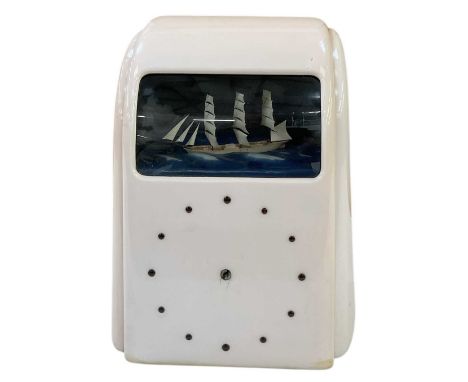 A 1930s Art Deco cream bakelite Vitascope clock automaton, height 31.5cm, width 24cm.Condition Report: Generally in good cond
