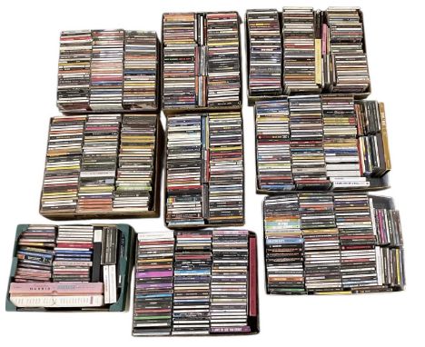 A large collection of pop CDs contained in boxes, including Pink Floyd, Otis Redding, The Beach Boys, The Kinks, Bob Marley a