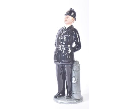 Royal Doulton – The Bobby – HN2778 – a hand painted ceramic figure / figurine of a policeman. Maker’s marks to base. Measures