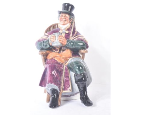 Royal Doulton – The Coachman – HN2282 – a hand painted ceramic figure / figurine of a seated gentleman with tankard. Maker’s 