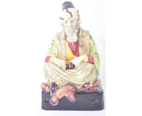 Royal Doulton – The Cobbler – HN1283 – a hand painted ceramic figure / figurine of an Arabic cobbler. Printed and hand signed