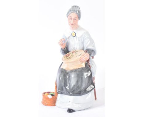 Royal Doulton – Embroidering - HN2855 (1979) - a hand painted ceramic figure / figurine of a seated old lady embroidering on 