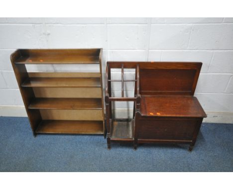 A 20TH CENTURY OAK HALL SETTLE, with a hinged seat and a shaped umbrella/stick stand, with drip tray, width 84cm x depth 32cm