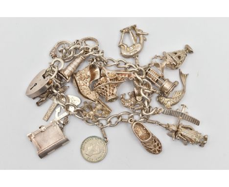 A WHITE METAL CHARM BRACELET, curb link bracelet fitted with a heart padlock clasp, stamped 'Silver', with additional safety 