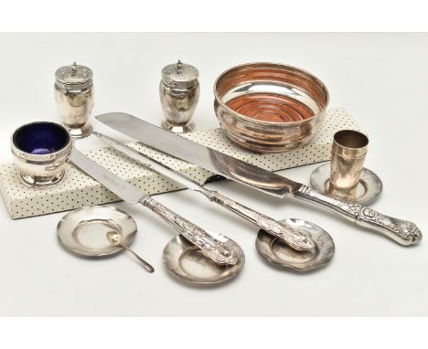 A BOX OF SILVER ITEMS, to include a pair of pepperettes, polished urn form with Celtic pattern collar, pierced covers with po