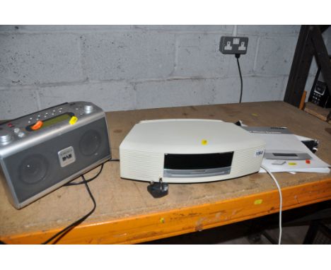 A BOSE AWRCC6 WAVE MUSIC SYSTEM with manual and remote (CD skips) and a Roberts RD20 DAB radio (both PAT pass and working unl