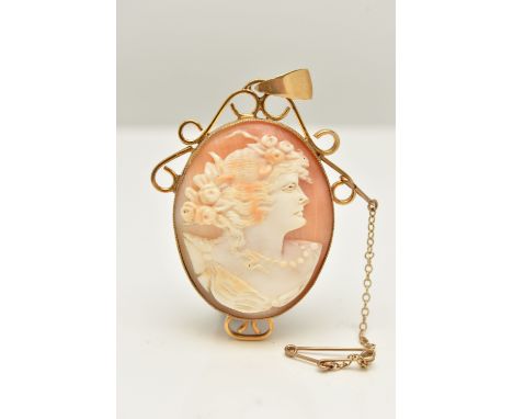 A YELLOW METAL CAMEO PENDANT, of an oval form, carved shell cameo depicting a lady in profile, milgrain collet setting, to th
