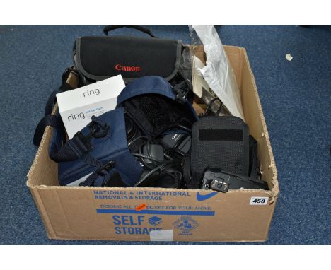 A BOX OF CAMERAS to include an un opened Ring indoor security camera, a Canon EOS 300d digital and carry case,  a Canon SX30 