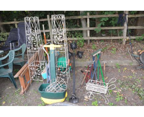 A COLLECTION OF GARDEN TOOLS AND ORNAMENTS including two metal framed structures 146cm high, a parasol and base, wooden and m