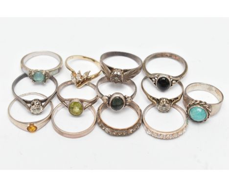 THIRTEEN RINGS, to include a moss agate cabochon ring, a small diamond ring in a star setting, a paste eternity ring, an onyx