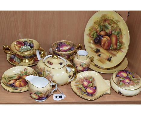 A GROUP OF AYNSLEY 'ORCHARD GOLD' TEAWARE, comprising a twin handled covered sugar bowl with printed D. Jones signature, two 