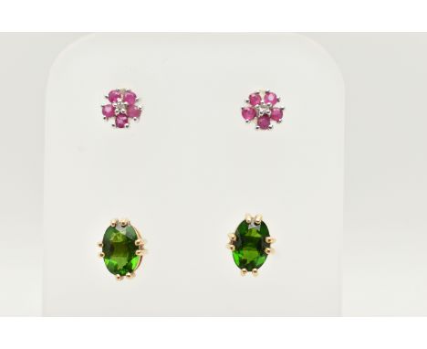 TWO PAIRS OF STUD EARRINGS, the first a pair of yellow metal oval cut green tsavorite garnet stud earrings, to the post and s