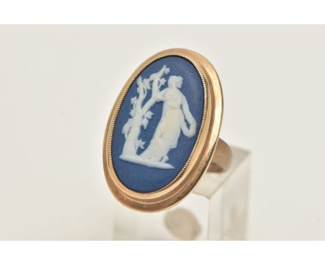 A 9CT GOLD WEDGWOOD RING, large blue and white Wedgwood inlay, singed to the reverse, in a milgrain collet setting, with a po