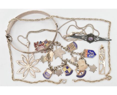 A SELECTION OF SILVER AND WHITE METAL JEWELLERY, to include a silver hinged bangle, a charm bracelet suspending enamel place 