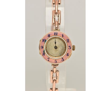 A LADIES 9CT GOLD AND PINK GUILLOCHE ENAMEL WRISTWATCH, manual wind, half hunter style, round dial with a pink guilloche enam