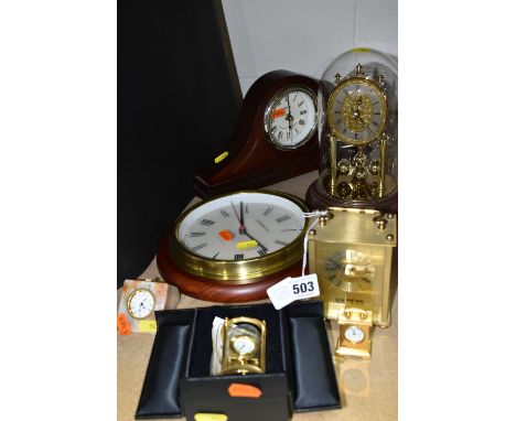 A GROUP OF SEVEN CLOCKS to include a an Acctim Mantel clock (evidence of battery leakage in to the battery pack), a Memolux w