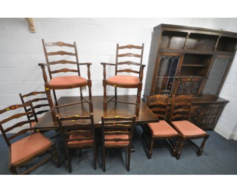 A 20TH CENTURY OAK DRAW LEAF DINING TABLE, raised on trestle legs, united by a stretcher, length 153cm x depth 92cm x height 