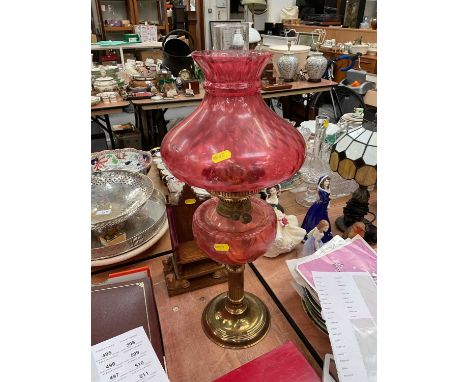 Cranberry glass and brass oil lamp with shade