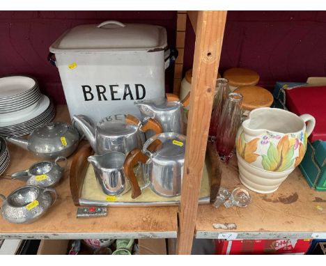 Enamel bread bin, piquot ware teaset and tray, pewter three piece teaset, Clarice Cliff jug, storage jars and cranberry glass