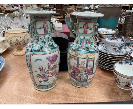 Pair of 19th century Chinese famille rose baluster vases painted with battle scenesOne has a chip and hairline at the top and