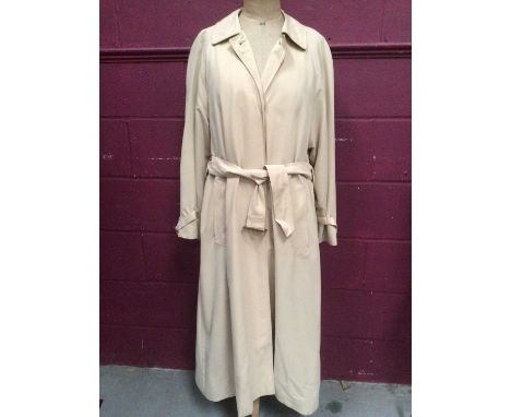 Two vintage Aquascutum women's trench coats to include a light beige one size 10 Regular and darker beige one with check lini